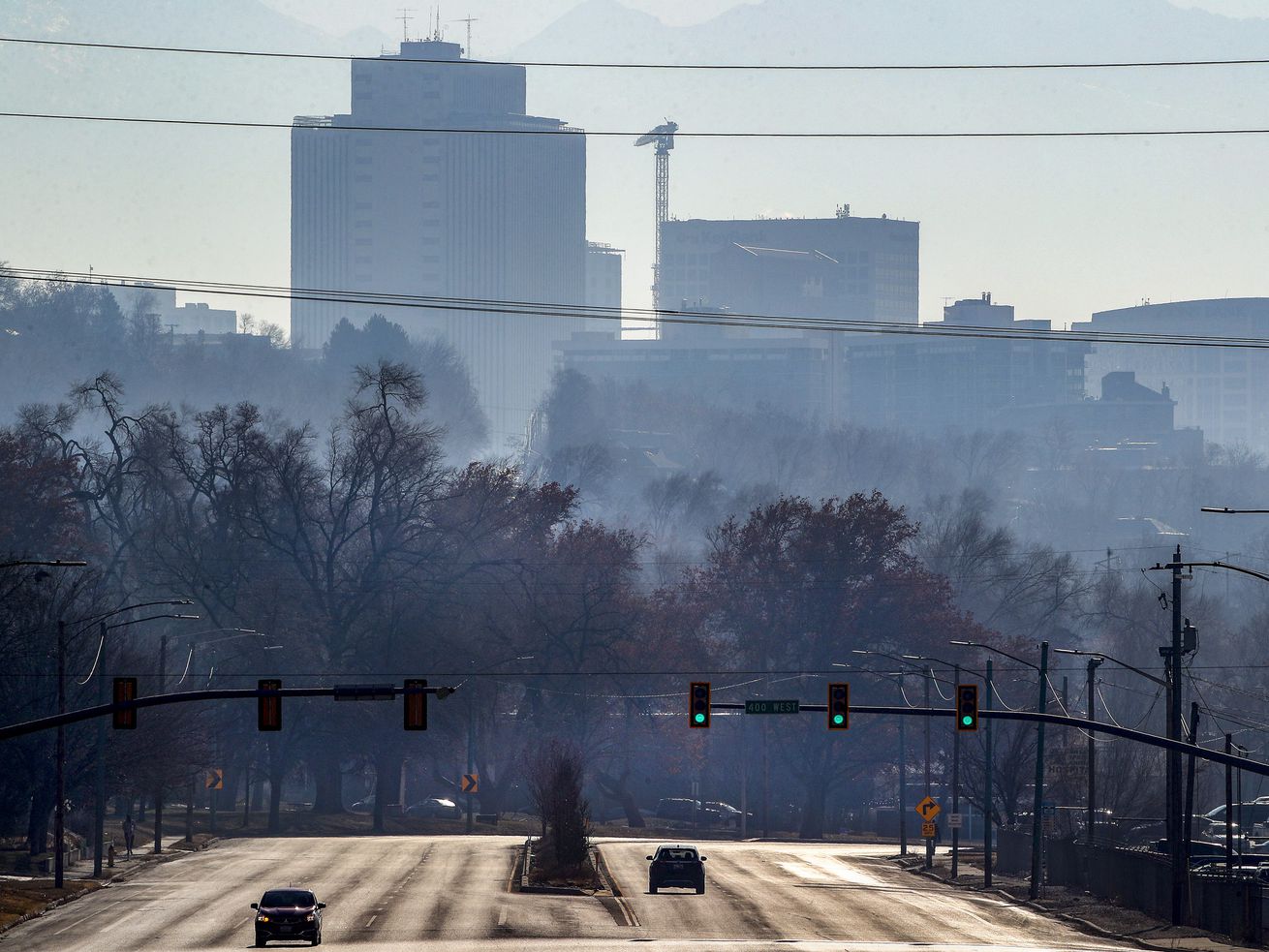Hazy air pollution shrouds downtown Salt Lake City as
cars move along Beck Street near 400 West on Monday, Dec. 7, 2020.