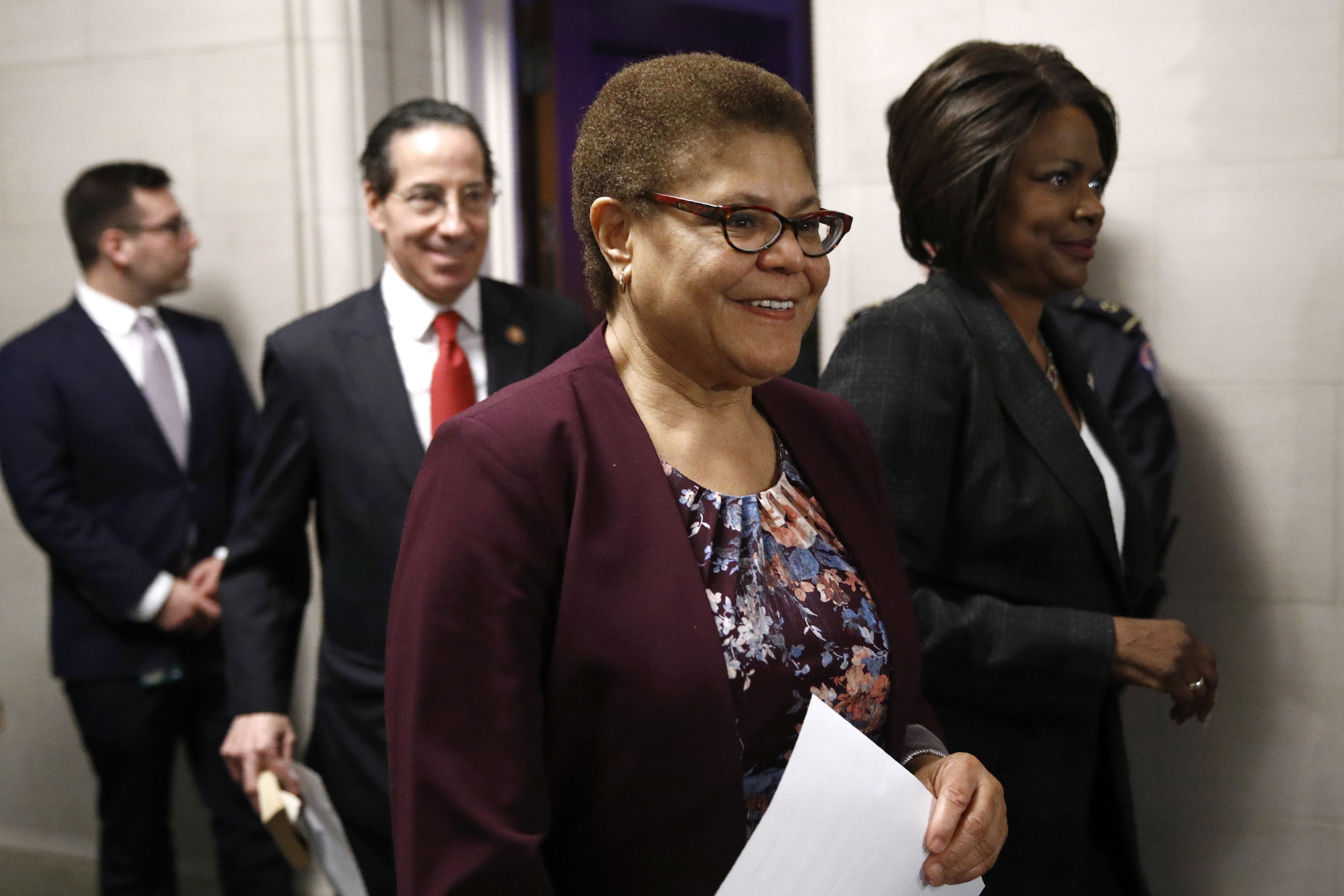 FILE - In this Dec. 9, 2019, file photo Rep. Karen Bass, D-Calif., center, walks out of a hearing room with Rep. Jamie Raskin, D-Md., second from left, and Rep. Val Demings, D-Fla., right.  (AP Photo/Patrick Semansky, File) [Jan-07-2021]