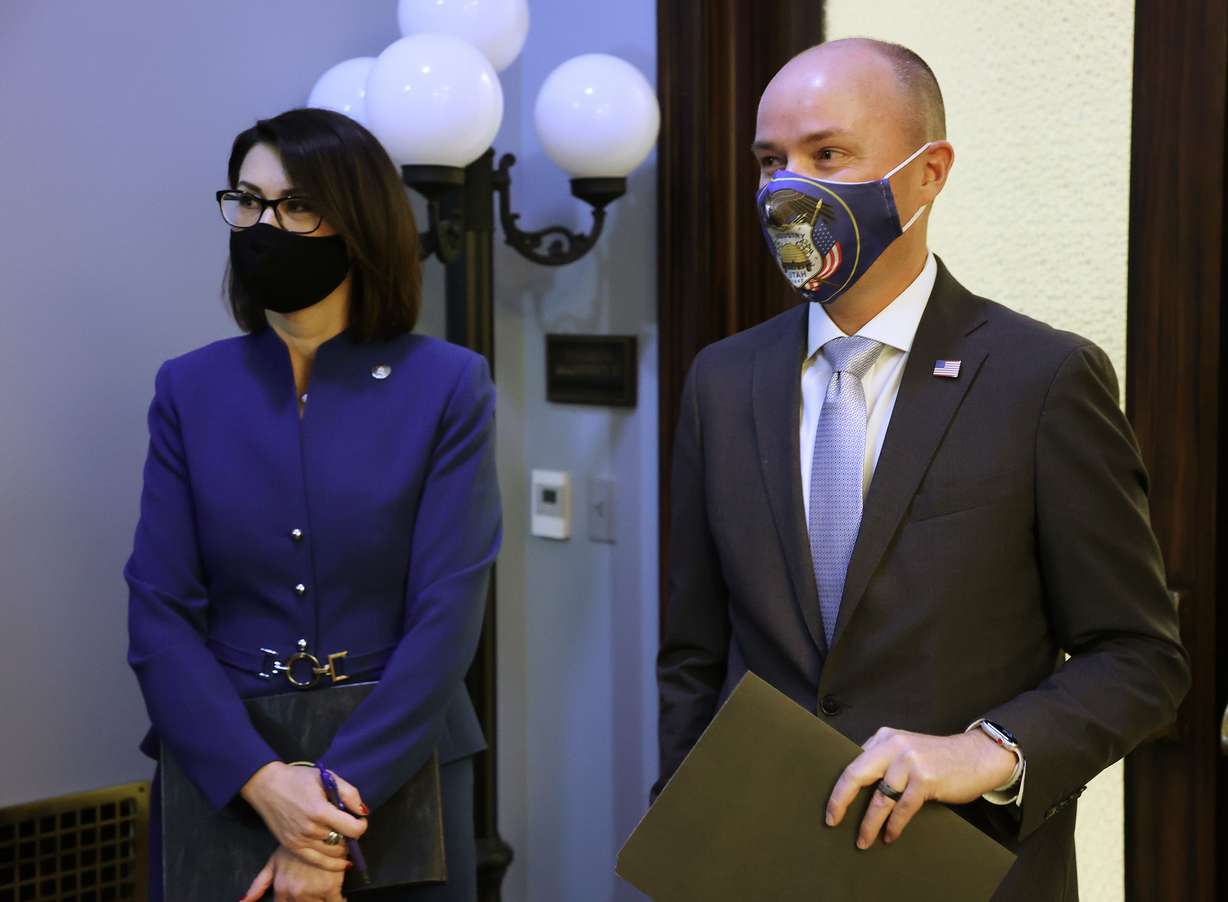 Lt. Gov. Deidre Henderson, left, and Gov. Spencer Cox wait for a COVID-19 briefing to begin at the Capitol in Salt Lake City on Friday, Jan. 8, 2021.