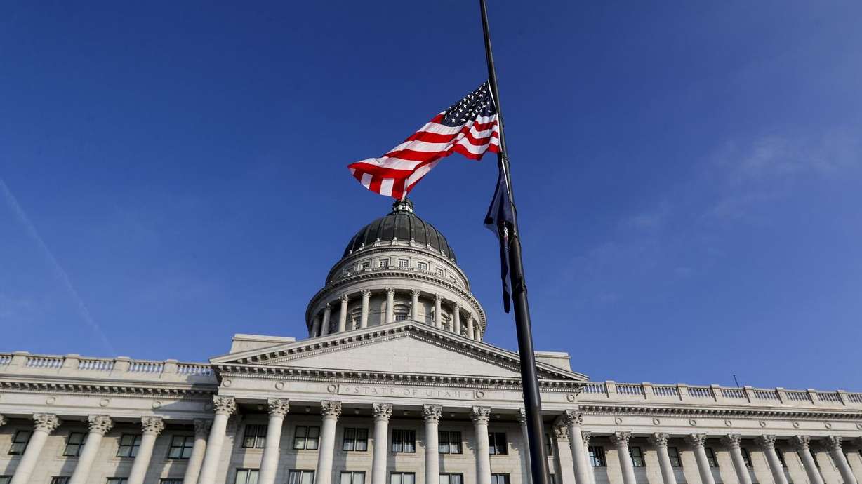 The U.S. and state flag fly at half-staff at the Utah
Capitol in Salt Lake City on Monday, Jan. 11, 2021, in honor of
Capitol Police officer Brian D. Sicknick, who died from injuries he
suffered when supporters of President Donald Trump stormed the U.S.
Capitol in Washington on Wednesday, Jan. 6, 2021.