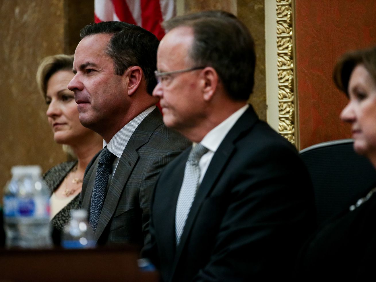 Speaker of the House Brad Wilson, R-Kaysville, second
from left, and Senate President Stuart Adams, R-Layton, third from
left, listen as Gov. Gary Herbert delivers his State of the State
address at the Capitol in Salt Lake City on Wednesday, Jan. 30,
2019. At far left is Wilson’s wife, Jeni Wilson, and at far right
is Adams’ wife, Susan Adams.