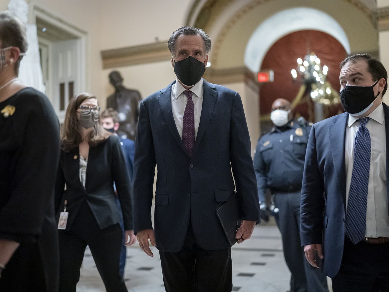 After violent protesters loyal to President Donald
Trump stormed the U.S. Capitol today, Sen. Mitt Romney, R-Utah,
joins other senators as they return to the House chamber to
continue the joint session of the House and Senate and count the
Electoral College votes cast in November’s election, at the Capitol
in Washington, Wednesday, Jan. 6, 2021.