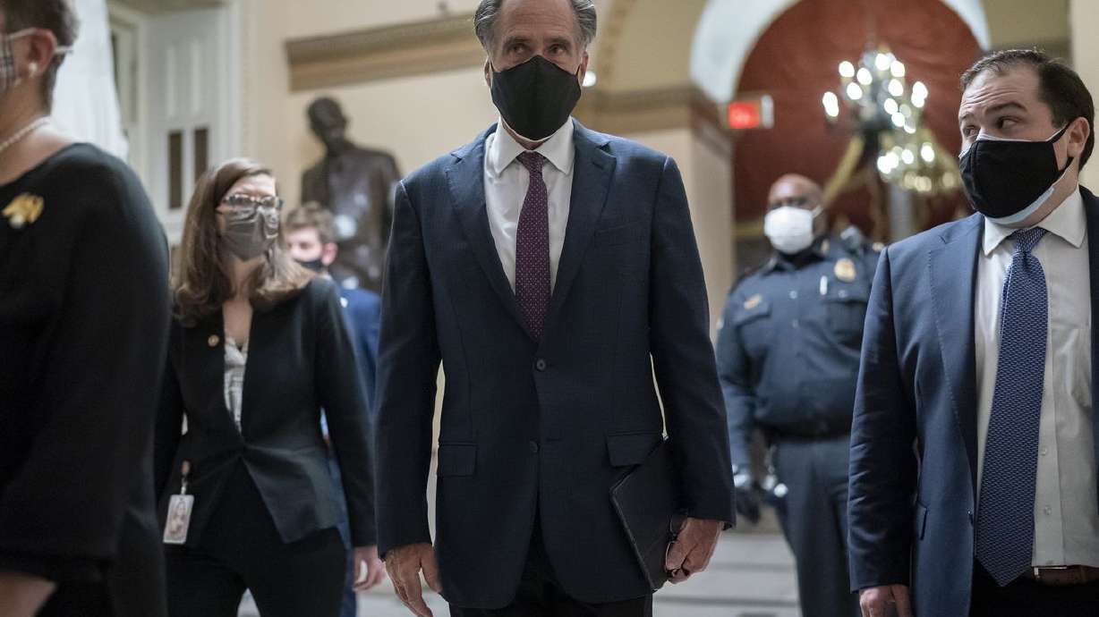 After violent protesters loyal to President Donald
Trump stormed the U.S. Capitol today, Sen. Mitt Romney, R-Utah,
joins other senators as they return to the House chamber to
continue the joint session of the House and Senate and count the
Electoral College votes cast in November’s election, at the Capitol
in Washington, Wednesday, Jan. 6, 2021.