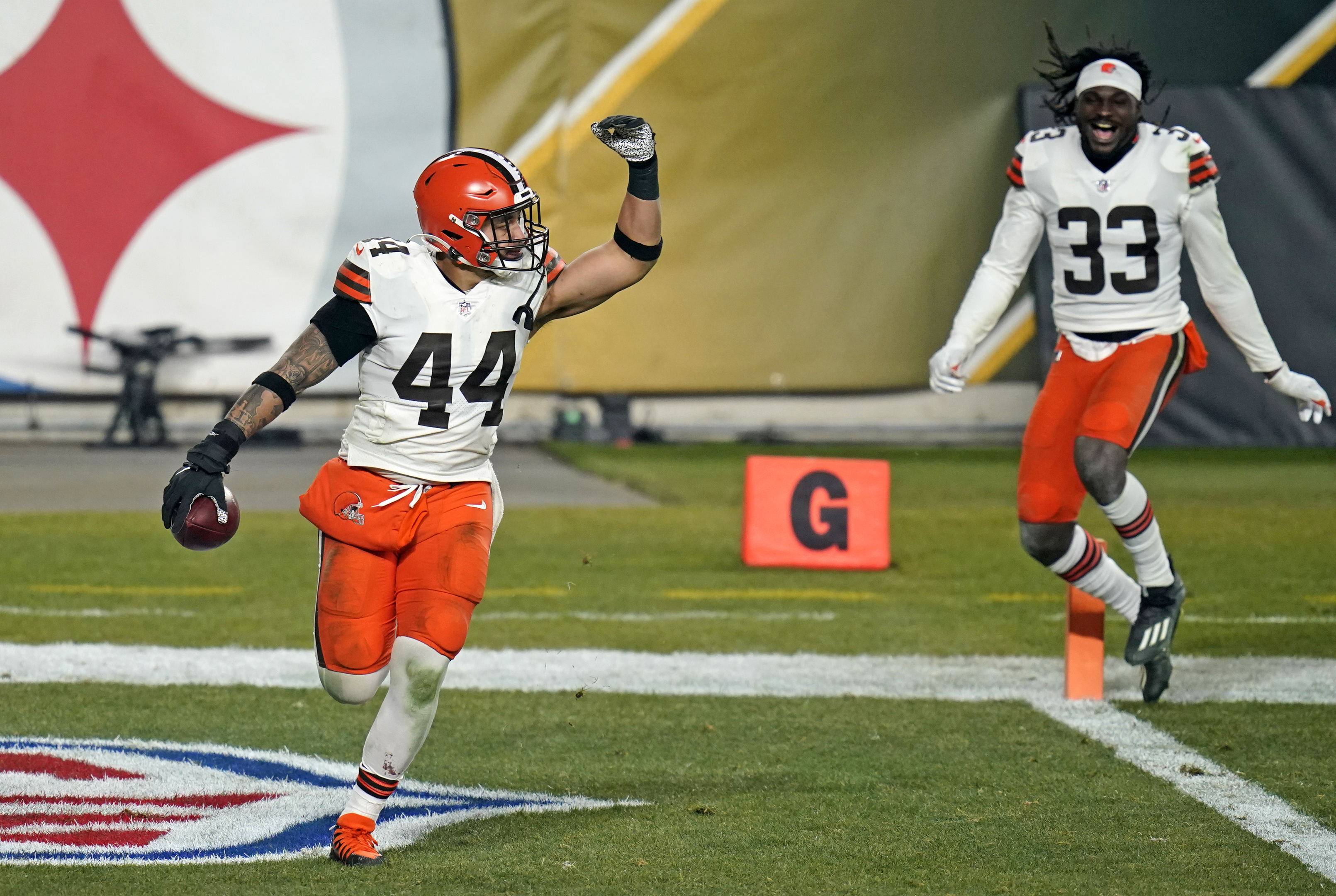 Cleveland Browns outside linebacker Sione Takitaki (44) celebrates after intercepting a pass by Pittsburgh Steelers quarterback Ben Roethlisberger (7) during the second half of an NFL wild-card playoff football game, Sunday, Jan. 10, 2021, in Pittsburgh.