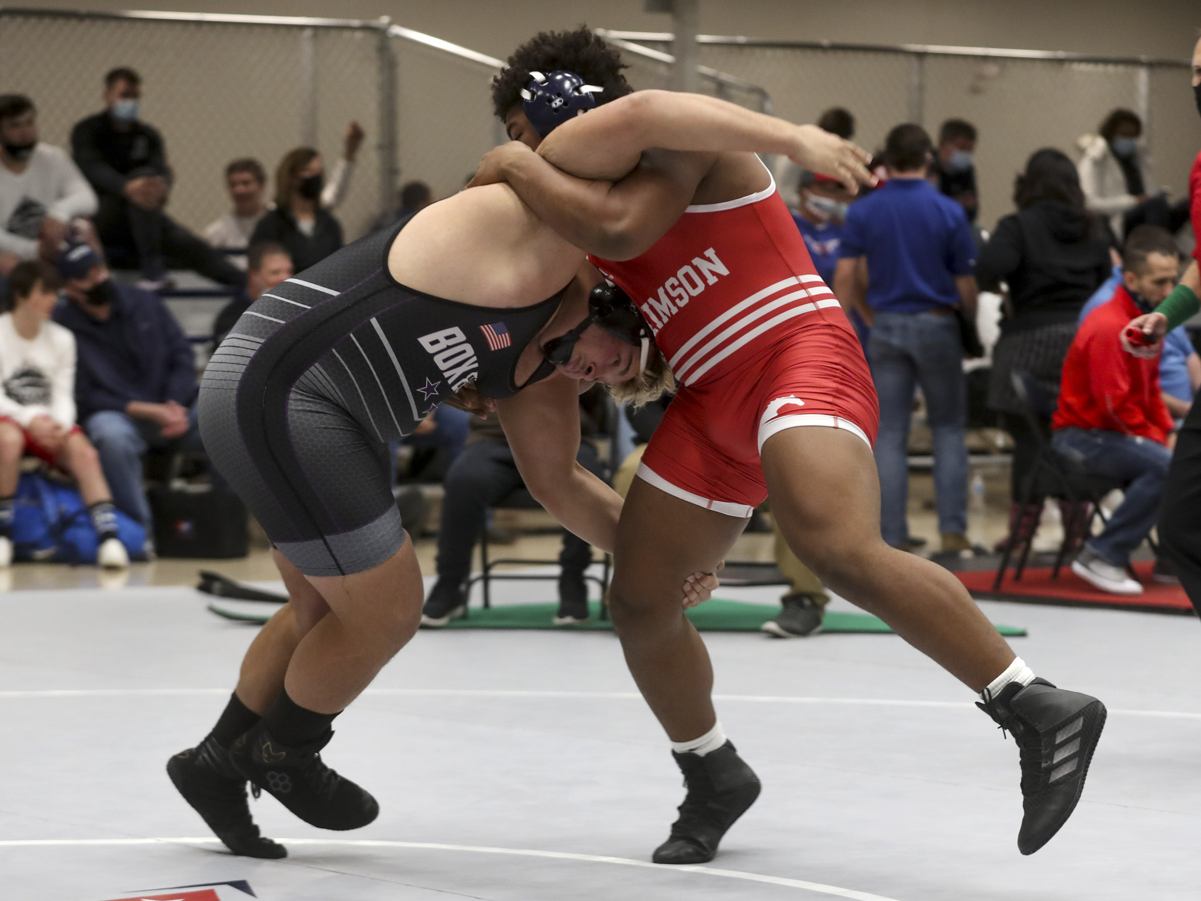 Kellen Collier, of Box Elder, left, drives into Jason Ponauisa, of Crimson Cliffs, during their 285-pound match during the Utah All-Star Duals event at Telos' gymnasium in Orem on Tuesday, Jan. 12, 2021.