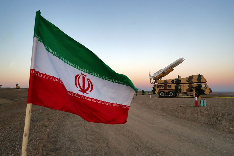 FILE PHOTO: An Iranian flag is pictured near in a missile during a military drill, October 19, 2020. WANA via REUTERS