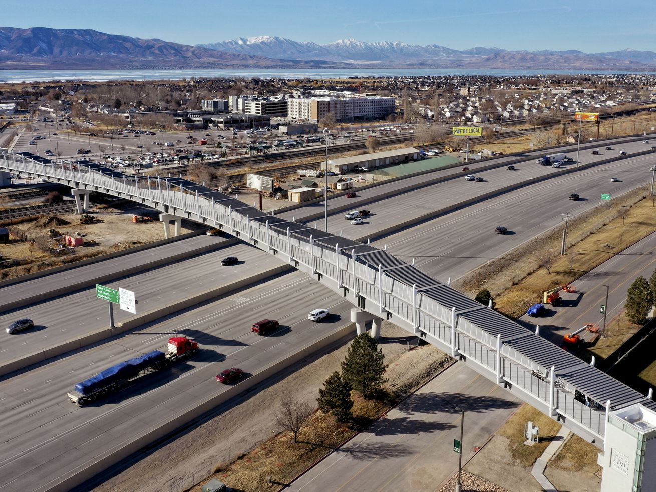 The new pedestrian bridge connecting Utah Valley
University with the Utah Transit Authority’s FrontRunner Orem
Central Station is pictured during its unveiling on Thursday,
Jan.14, 2021. Crews will continue putting the finishing touches on
the bridge over the next few weeks, with an expected opening in
early February.