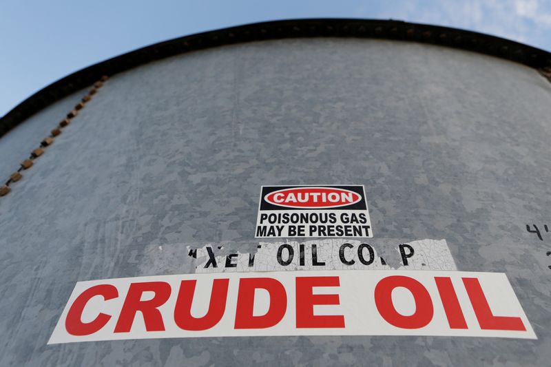 FILE PHOTO: A sticker reads crude oil on the side of a storage tank in the Permian Basin in Mentone, Loving County, Texas, U.S. November 22, 2019.   REUTERS/Angus Mordant