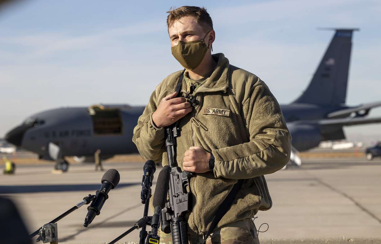 Utah National Guard Spc. MacArthur, whose first name was withheld for security reasons, answers journalists' questions as members of the Utah National Guard board KC-135 jets at Roland R. Wright Air National Guard Base in Salt Lake City on Friday, Jan. 15, 2021. The Guardsmen are bound for Washington, D.C., to support civil authorities during the inauguration of President-elect Joe Biden.