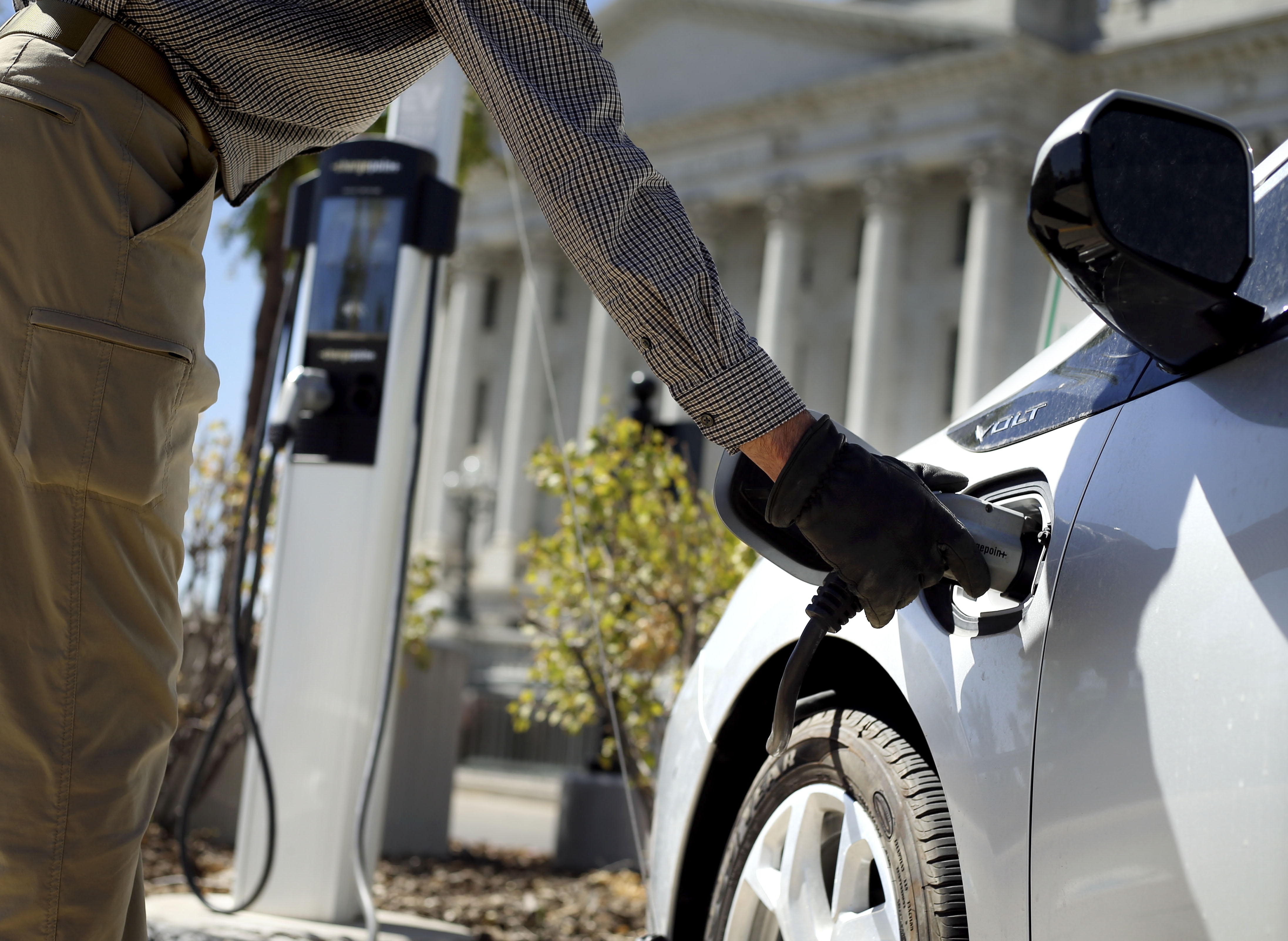 Jon Barney disconnects his electric car from a charging station at the Capitol in Salt Lake City on Thursday, Sept. 3, 2020. YourAirYourUtah.org is a new website that provides a conduit for residents, businesses, developers and government entities to embrace strategies for cutting down on pollution that ultimately impairs air quality.