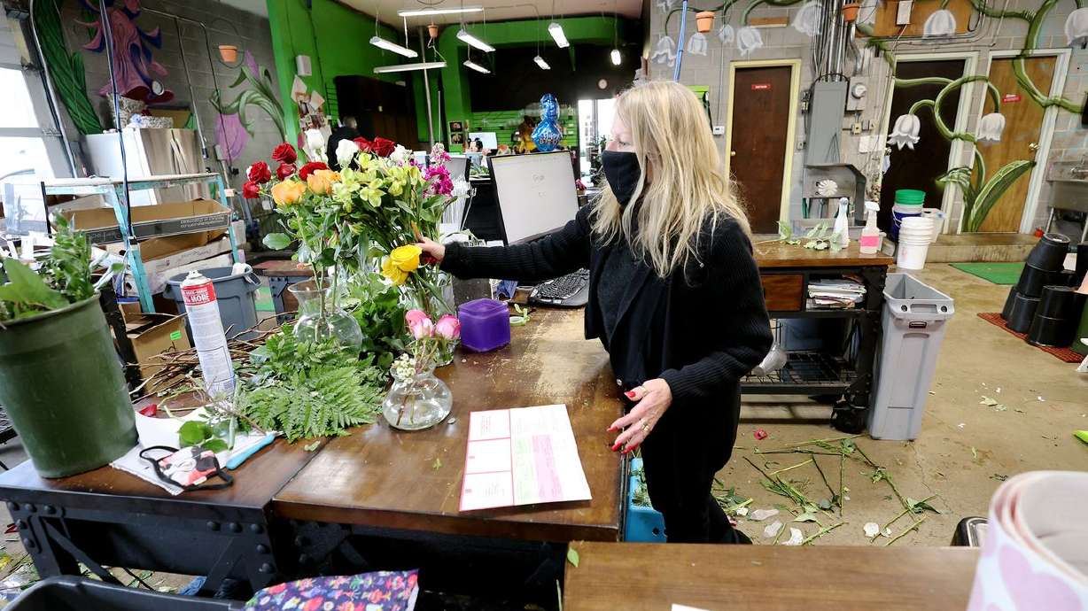 Marci Rasmussen, owner of Especially For You Your
Downtown Florist, works on a floral arrangement at her shop in
Salt Lake City on Tuesday, Jan. 12, 2021. Rasmussen applied for
Paycheck Protection Program funding during the first round of
stimulus last year to keep her business afloat and will also apply
for the latest round of funding.