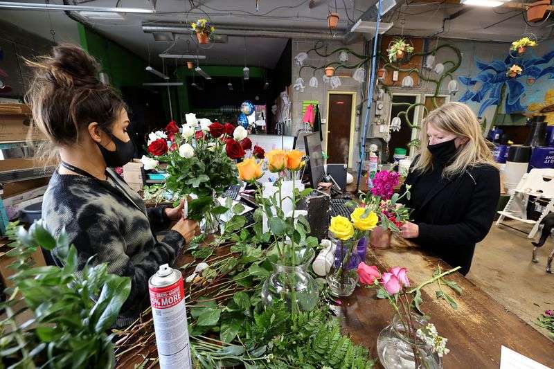 Natalie Rasmussen, left, and her mother-in-law, Marci
Rasmussen, owner of Especially For You Your Downtown Florist,
create floral arrangements at the shop in Salt Lake City on
Tuesday, Jan. 12, 2021. Marci Rasmussen applied for Paycheck
Protection Program funding during the first round of stimulus last
year to keep her business afloat and will also apply for the latest
round of funding.