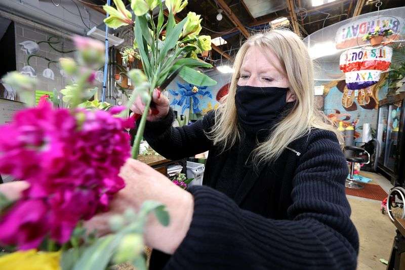 Marci Rasmussen, owner of Especially For You Your
Downtown Florist, assembles an order at the shop in Salt Lake City
on Tuesday, Jan. 12, 2021. Rasmussen applied for Paycheck
Protection Program funding during the first round of stimulus last
year to keep her business afloat and will also apply for the latest
round of funding.