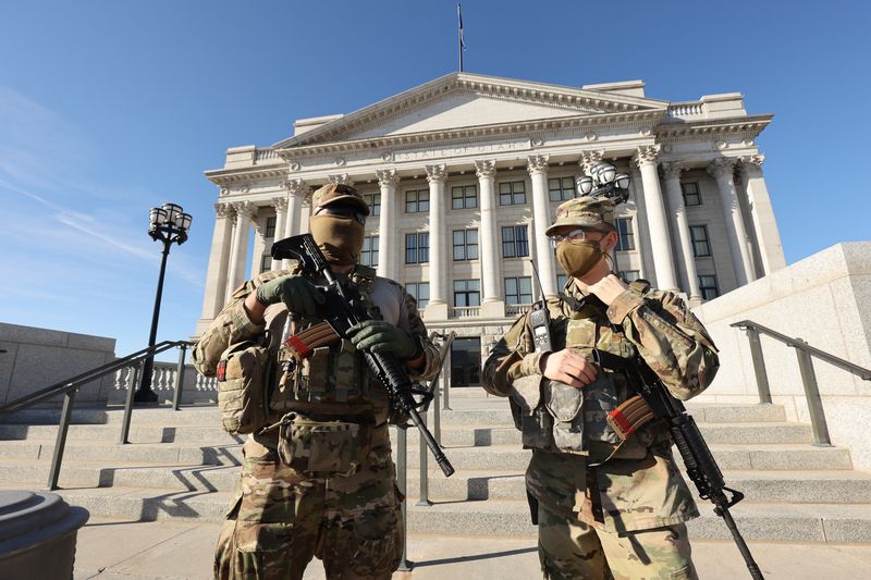 Utah National Guard Specialist Alejandro Castaneda,
left, and 2nd Lt. Cody Preszler stand guard before the planned
protest at the state Capitol in Salt Lake City on Sunday, Jan. 17,
2020.
