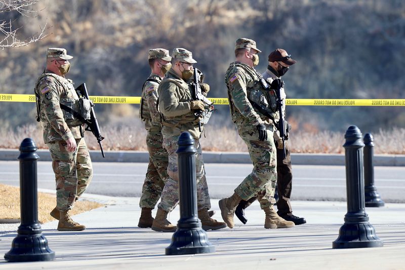 Members of the Utah National Guard and law enforcement
assemble before the planned protest at the state Capitol in Salt
Lake City on Sunday, Jan. 17, 2020.
