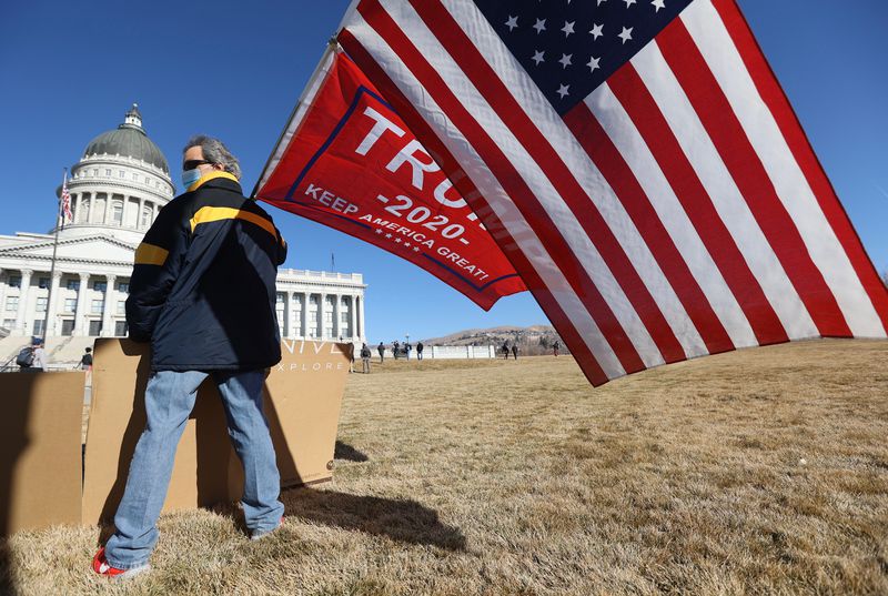 About a dozen demonstrators gathered for the start of a
protest Sunday morning, with some there to rally against government
in general, and others to support outgoing President Donald Trump.
"I’m here to support Trump. He got railroaded,” Pete Liacopoulos
said at the protest at the state Capitol in Salt Lake City Sunday,
Jan. 17, 2020.