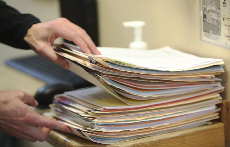 Hope Clinic physician assistant Matt Pierce looks for
patient information at the clinic in Midvale on Wednesday, Jan. 6,
2021. Two bills to be considered by the Utah Legislature would
broaden the role of physician assistants to let them offer mental
health therapy and respond during a health emergency.