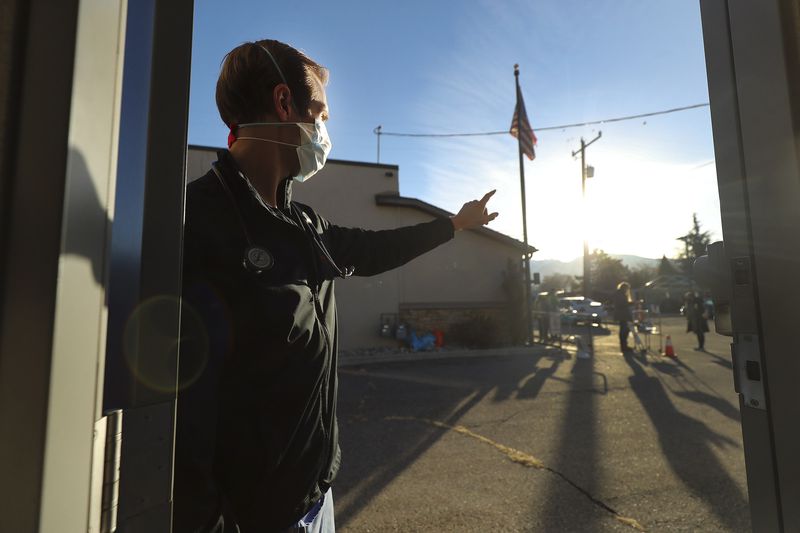 Hope Clinic physician assistant Matt Pierce waits for
his next patient at the clinic in Midvale on Wednesday, Jan. 6,
2021. Two bills to be considered by the Utah Legislature would
broaden the role of physician assistants to let them offer mental
health therapy and respond during a health emergency.
