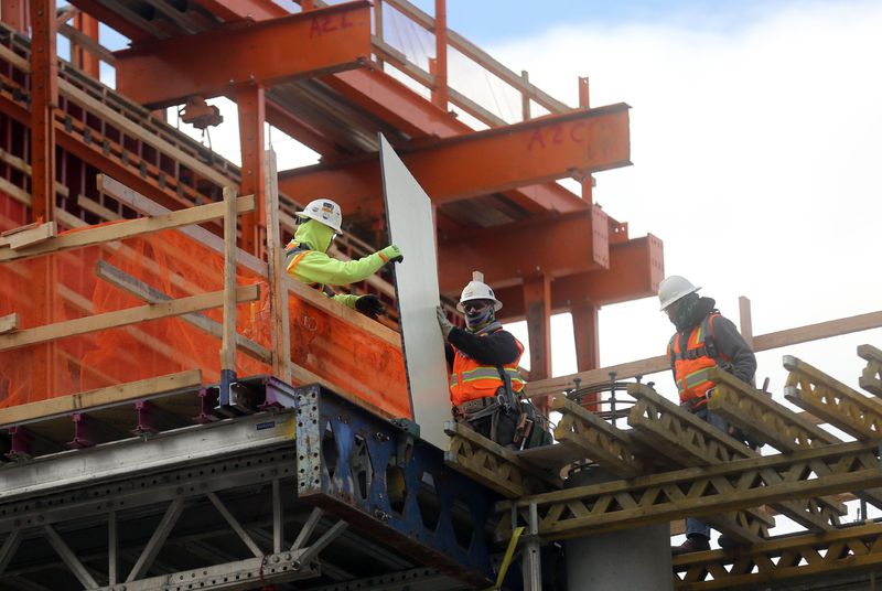 Construction crews work on the 25-floor, 700-room Hyatt
Regency Salt Lake City adjoining the Salt Palace Convention Center
in Salt Lake City on Wednesday, Jan. 13, 2021.