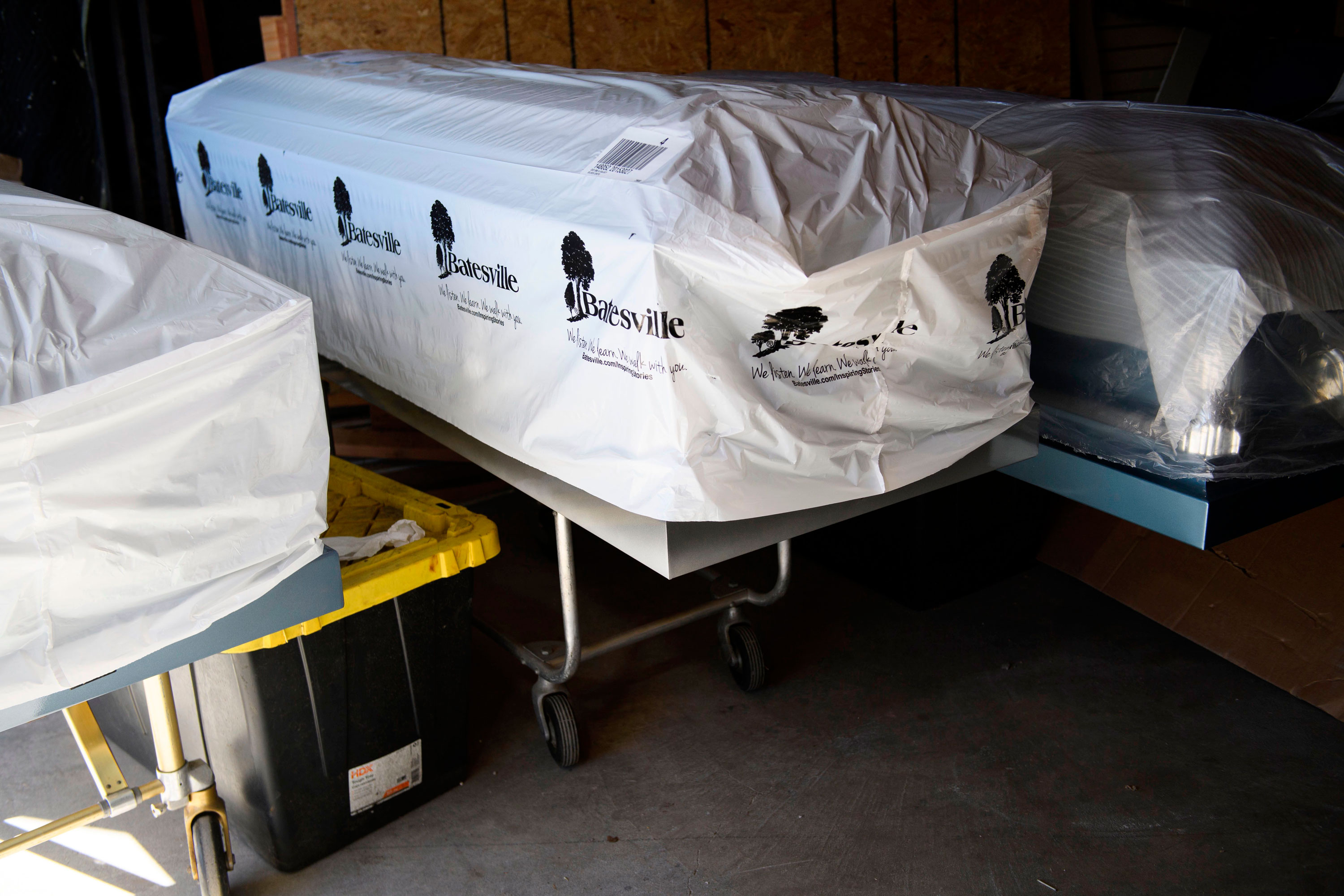 Covered empty caskets stand in a garage at the Boyd Funeral Home during a surge of Covid-19 deaths on January 14, 2021 in Los Angeles, California. - A corpse in the break room. Embalmed bodies in the garage.
Boyd Funeral Home, a small family business in Los Angeles, is so overflowing with Covid-19 victims it has begun turning away customers for the first time in its history.
"The weekend before I turned down 16 families that I couldn't do services for," said owner Candy Boyd.
"It's sad. But that's pretty much how it is now."