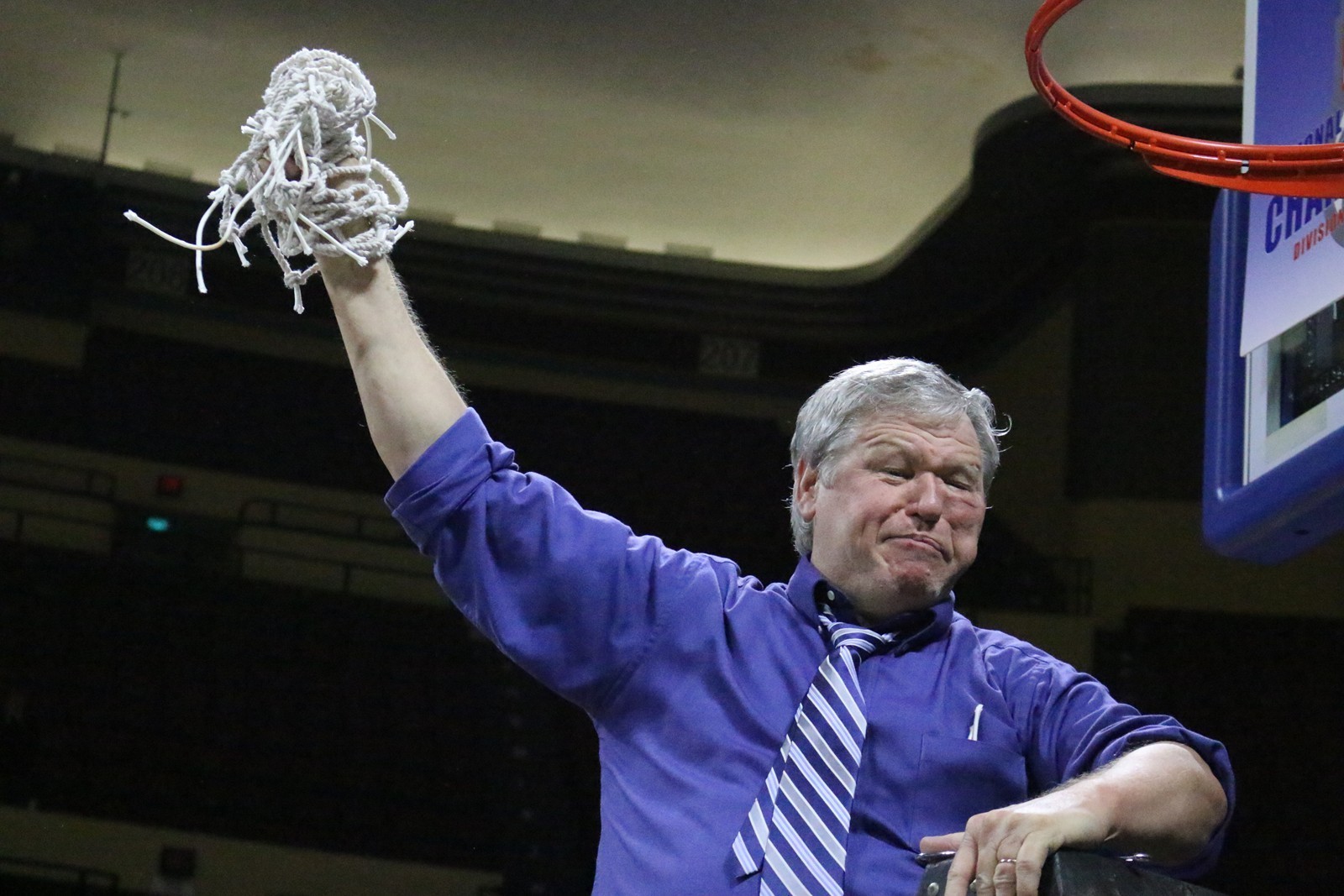 Former BYU basketball coach Tony Ingle, shown here cutting down the nets after a big Dalton State College victory, enjoyed considerable success since leaving Provo, including winning an NAIA national championship and NAIA National Coach of the Year honors.