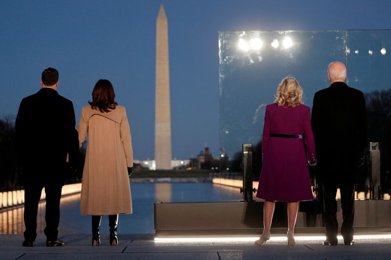 U.S. President-elect Joe Biden, his wife Jill Biden, Vice President-elect Kamala Harris and her husband Doug Emhoff stand in front of the Washington Monument ahead of Biden's remarks in Washington, U.S. January 19, 2021.