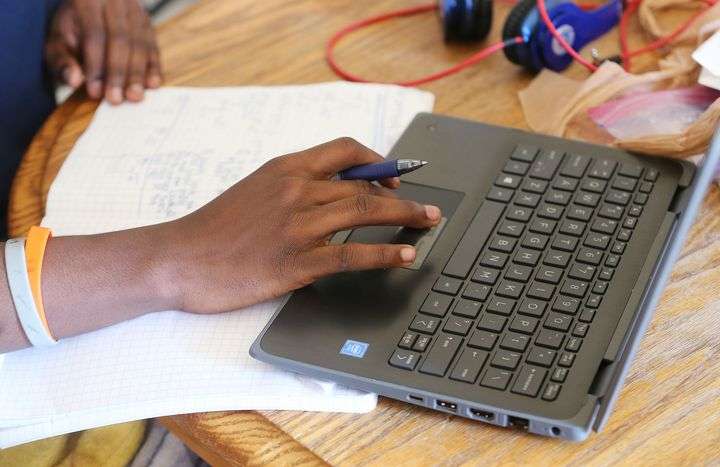 Richard Vyukusengere attends school remotely at home in Salt Lake City on Tuesday, Jan. 19, 2021. Salt Lake City parents who are suing the Salt Lake City School District are asking for an injunction to allow for an in-person learning option.