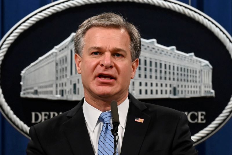 FILE PHOTO: FBI Director Christopher Wray speaks during a press conference to announce that two alleged Islamic State militants known as the 'Beatles' will arrive in the United States to face trial on U.S. charges for their alleged involvement in beheadings of Western hostages, at the Justice Department in Washington, U.S., October 7, 2020. Jim Watson/Pool via REUTERS