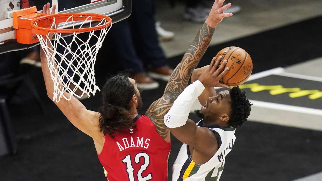 New Orleans Pelicans center Steven Adams (12) defends against Utah Jazz guard Donovan Mitchell during the first half of an NBA basketball game Thursday, Jan. 21, 2021, in Salt Lake City. (AP Photo/Rick Bowmer)