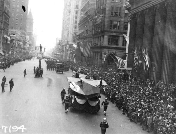 In this Sept. 28, 1918 photo provide by the U.S. Naval History and Heritage Command the Naval Aircraft Factory float moves south on Broad Street escorted by Sailors during the a parade meant to raise funds for the war effort, in Philadelphia. The Mutter Museum will present a parade on Saturday Sept. 28, featuring about 500 members of the public, four illuminated floats and an original piece of music as a sort of moving memorial to the 1918-1919 influenza pandemic.