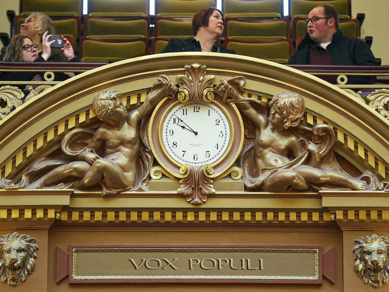 People begin to fill the gallery above the clock in the
House of Representatives during a break at the Capitol in Salt Lake
City on Thursday, Jan. 30, 2020.