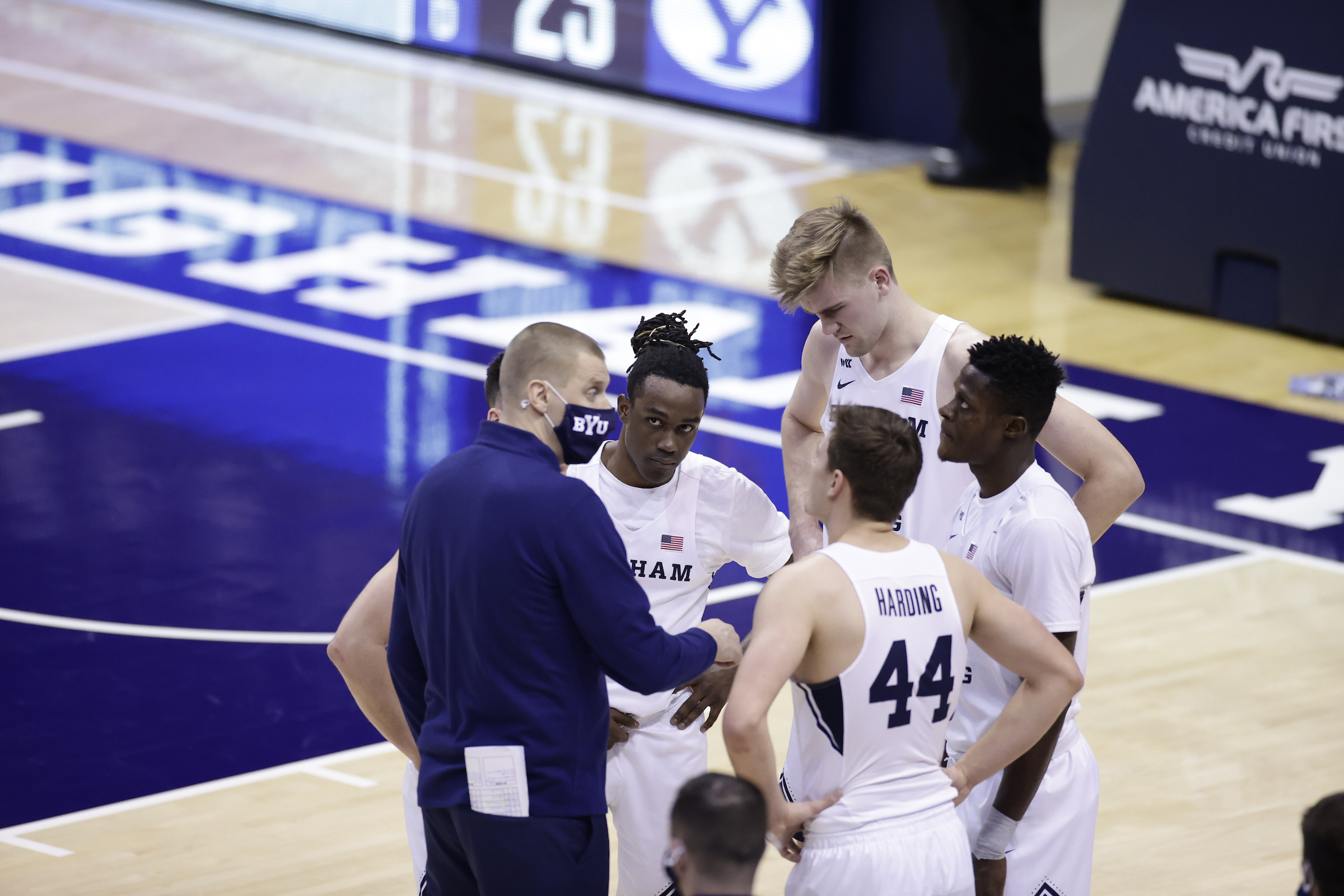 BYU guard Brandon Averette looks at coach Mark Pope during a timeout during a West Coast Conference game against Pepperdine, Saturday, Jan. 23, 2021 in Provo.
