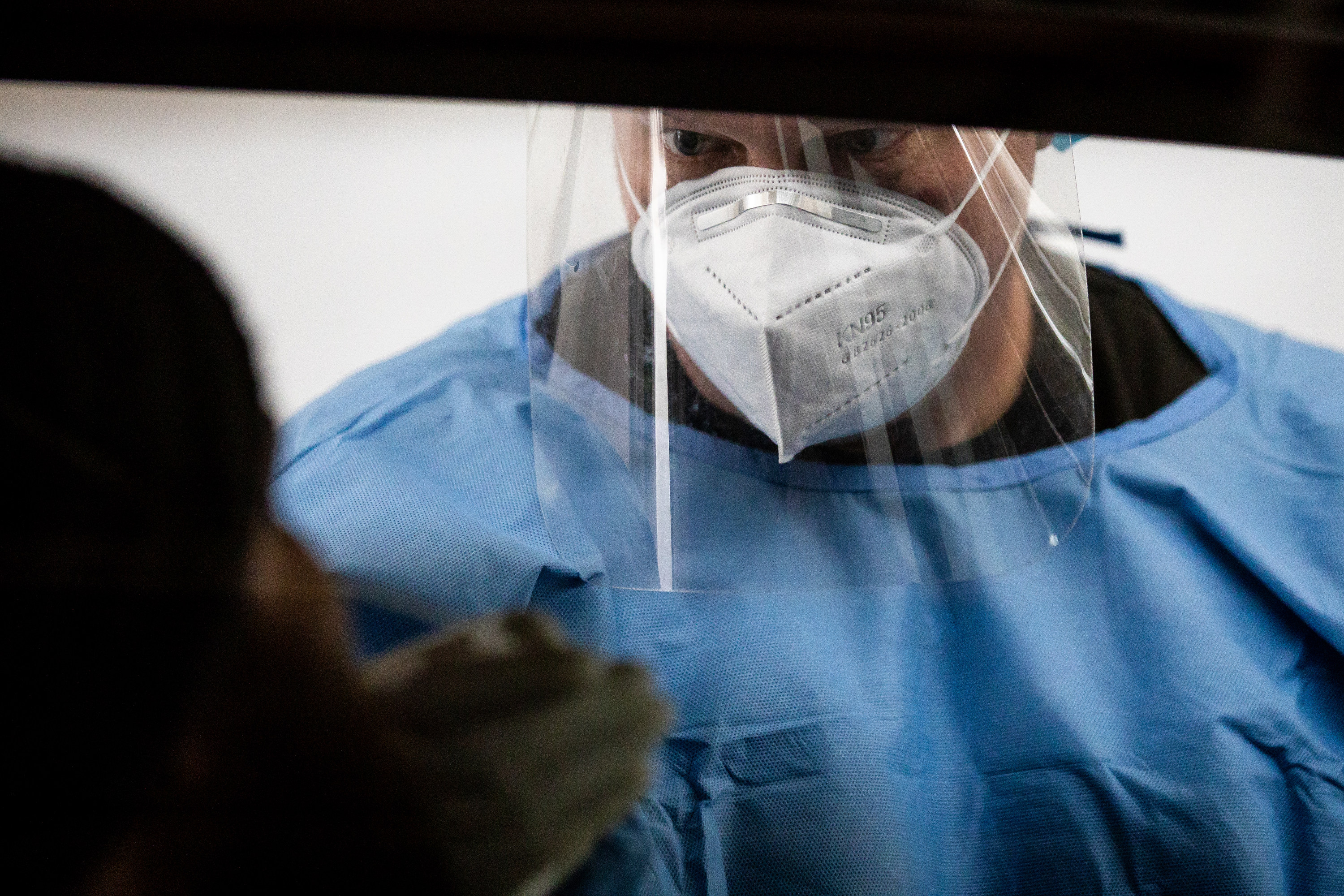 Utah National Guard Sgt. 1st Class Sean Conorich conducts COVID-19 rapid testing at the Fairpark in Salt Lake City on Saturday, Jan. 23, 2021.