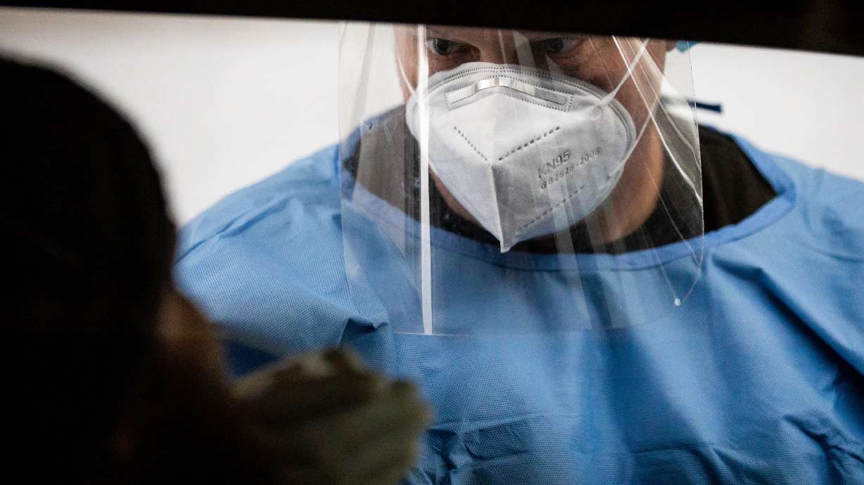 Utah National Guard Sgt. 1st Class Sean Conorich conducts COVID-19 rapid testing at the Fairpark in Salt Lake City on Saturday, Jan. 23, 2021. Utah Department of Health officials said Friday they have discovered its first omicron variant of COVID-19 in the state.