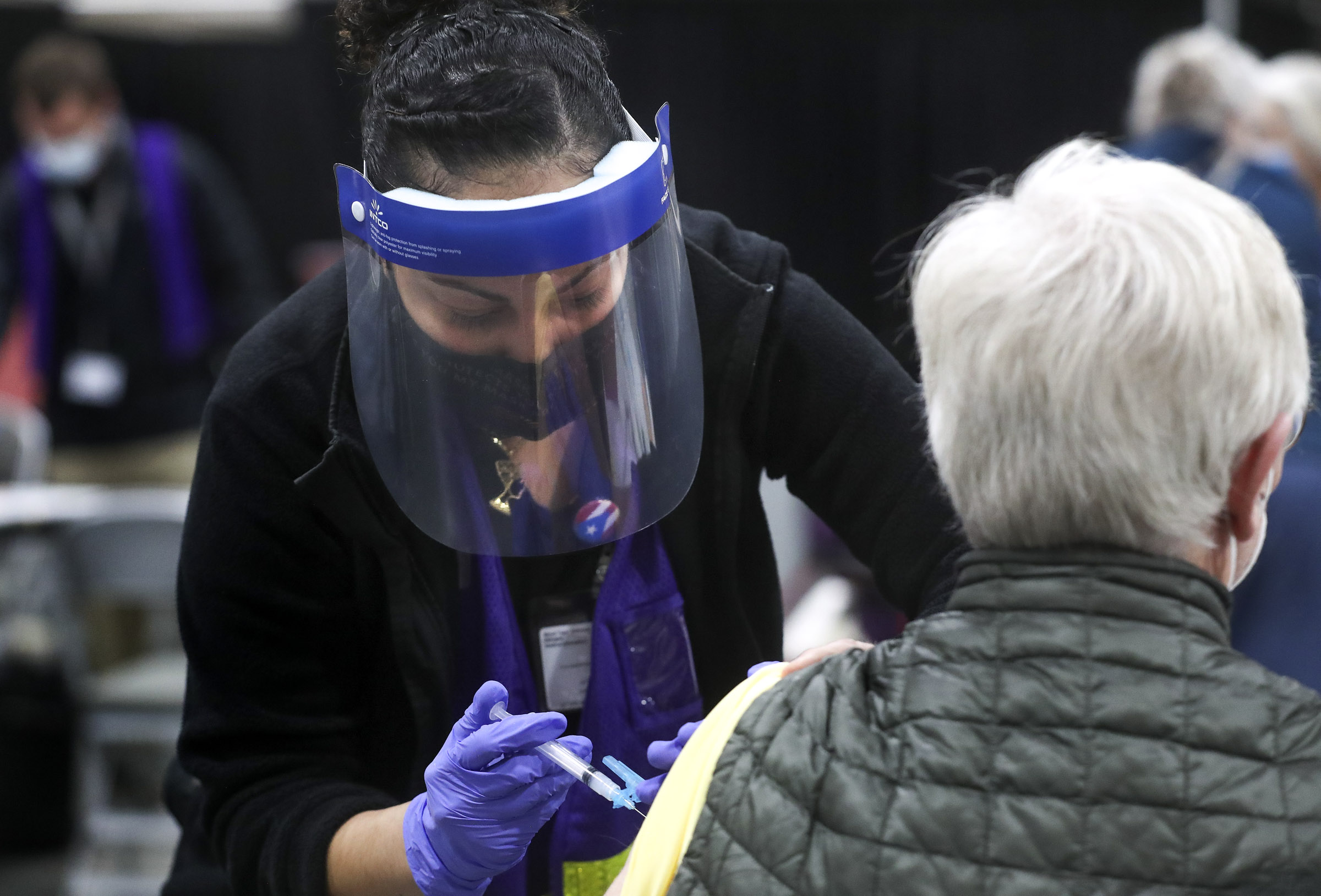 Rosa Valdiziez, a Salt Lake County Health Department nurse, administers a dose of the Moderna COVID-19 vaccine at the countyâ??s mass vaccination site at the Mountain America Expo Center in Sandy on Monday, Jan. 18, 2021.