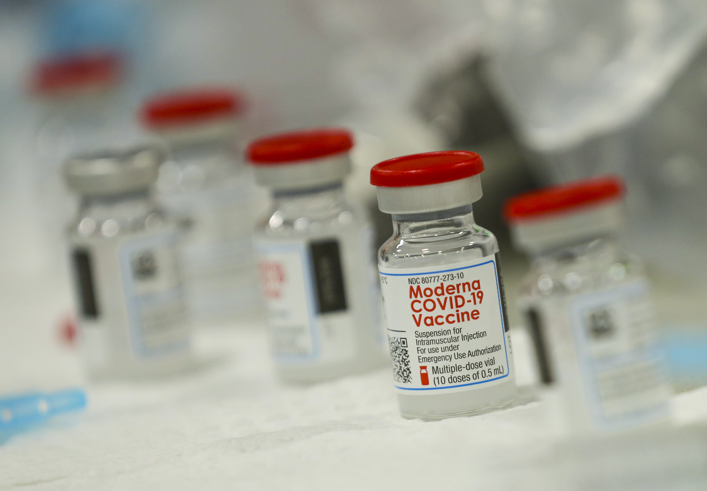 Syringes are filled with the Moderna COVID-19 vaccine at Salt Lake County's mass vaccination site at the Mountain America Expo Center in Sandy on Monday, Jan. 18, 2021.