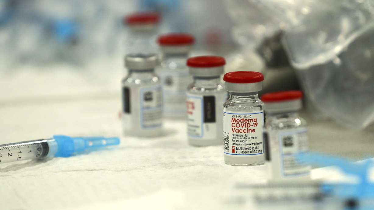 Syringes are filled with the Moderna COVID-19 vaccine at Salt Lake Countyâ??s mass vaccination site at the Mountain America Expo Center in Sandy on Monday, Jan. 18, 2021.