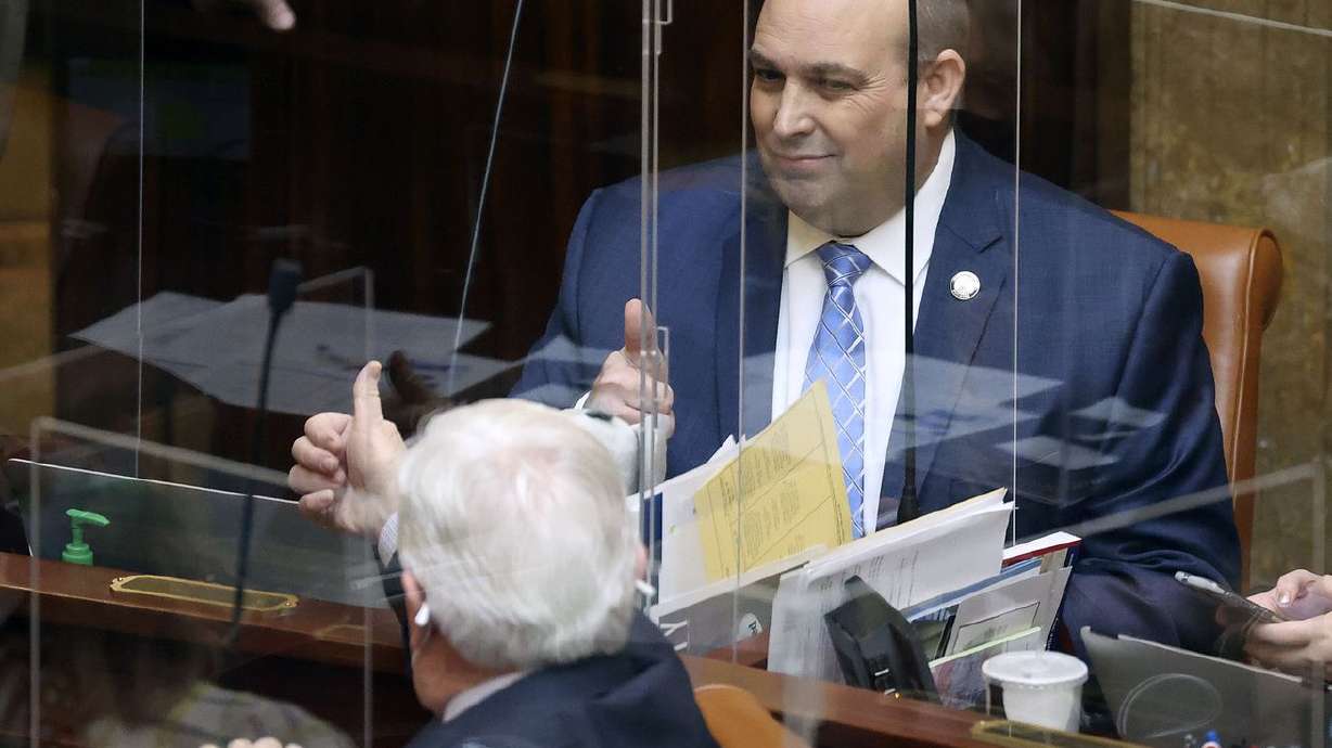 Rep. V. Lowry Snow, R-Santa Clara, left, and Rep. Walt
Brooks, R-St. George, give each other a thumbs-up after the House
passed HB60 at the Capitol in Salt Lake City Tuesday, Jan. 26,
2021. The bill drops the permit requirement for Utahns to carry a
concealed firearm.
