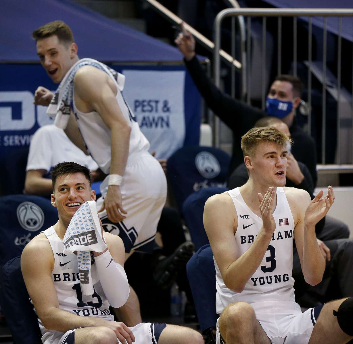 BYU guard Alex Barcello (13) and Matt Haarms (3) make jokes from the bench as their teammates play against Portland at the Marriott Center in Provo on Thursday, Jan. 21, 2021.