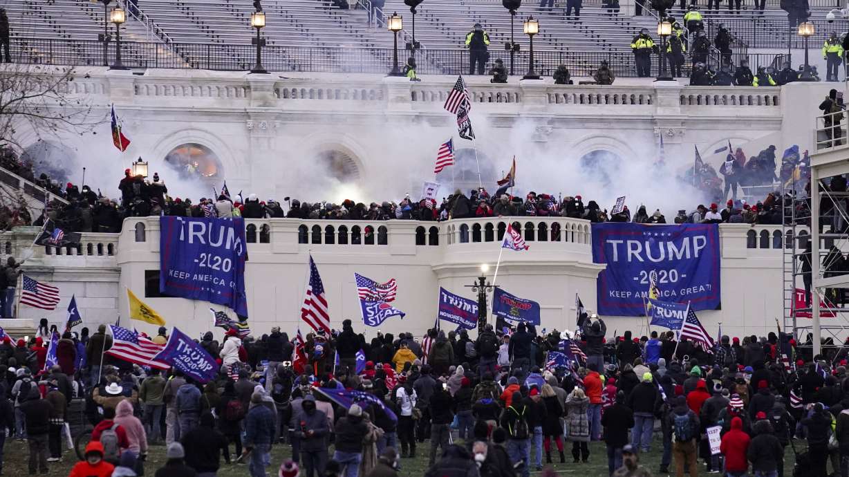 Violent protesters, loyal to President Donald Trump, storm the U.S. Capitol Building on Jan. 6, 2021, in Washington. A Salt Lake City man was sentenced Wednesday for his role in the attack on the Capitol.