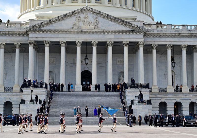 FILE PHOTO: President of the United States Joe Biden, first lady Jill Biden, U.S. Vice President Kamala Harris and second gentleman Douglas Emhoff stand at the east steps of the U.S. Capitol  after the 59th Presidential Inauguration in Washington, U.S., January 20, 2021.  David Tulis/Pool via REUTERS