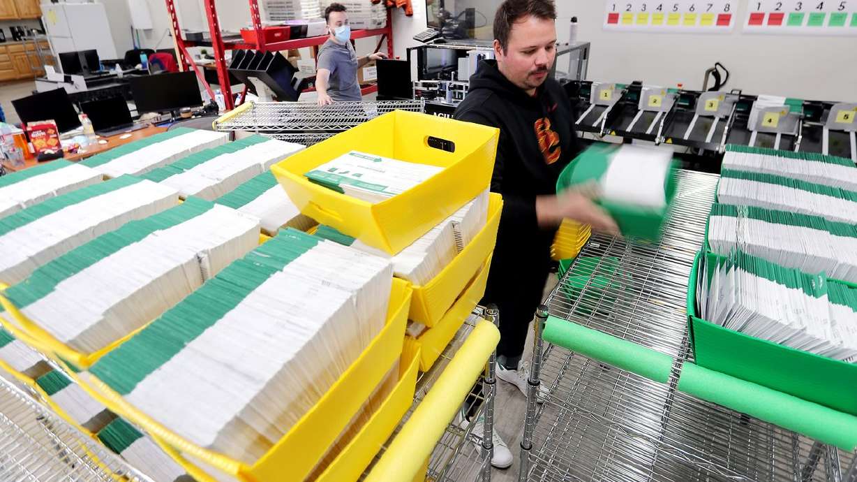 Election ballots are processed by workers at the Utah
County Clerk/Auditor’s Office in Provo on Tuesday, Oct. 27, 2020.
