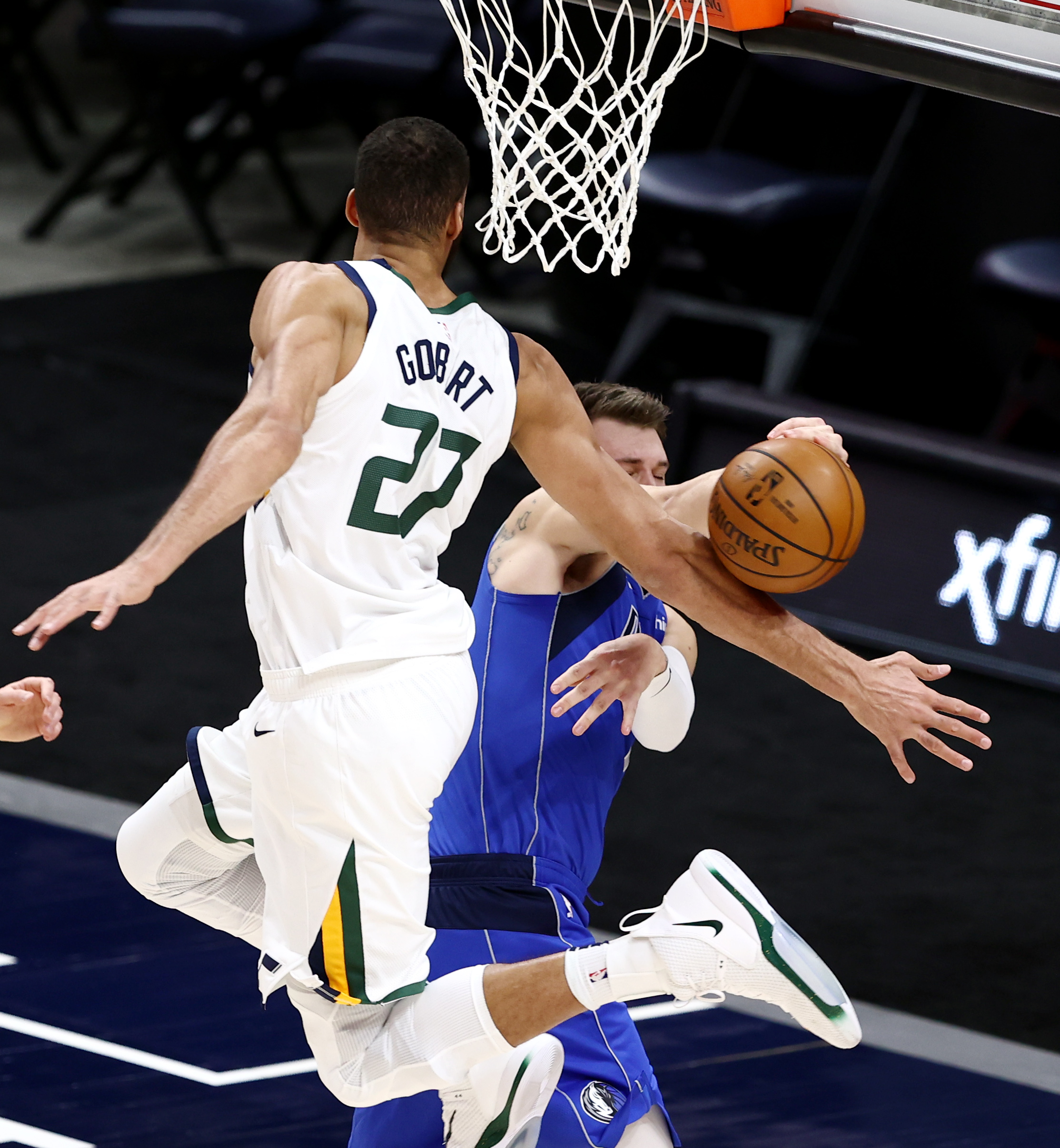 Utah Jazz center Rudy Gobert (27) knocks down a pass by Dallas Mavericks guard Luka Doncic (77) as the Utah Jazz and the Dallas Mavericks play an NBA basketball game at Vivint Smart Home Arena in Salt Lake City on Wednesday, Jan. 27, 2021.