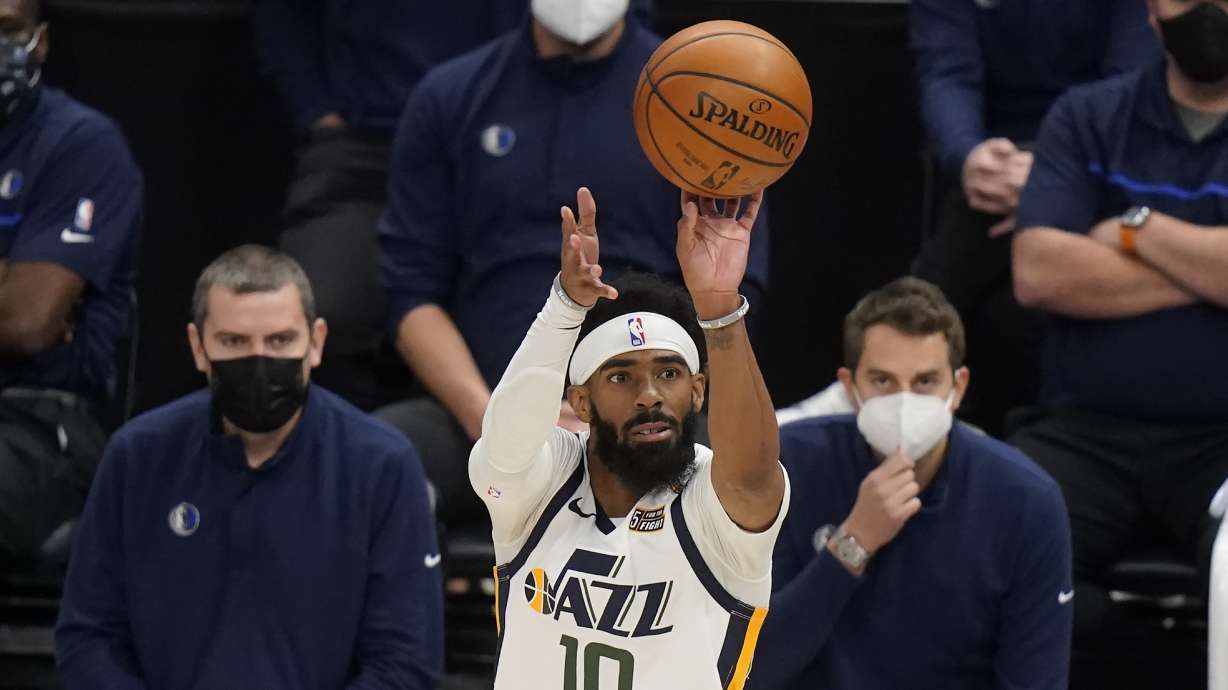 Utah Jazz guard Mike Conley (10) shoots a 3-pointer in the second half during an NBA basketball game against the Dallas Mavericks on Wednesday, Jan. 27, 2021, in Salt Lake City.