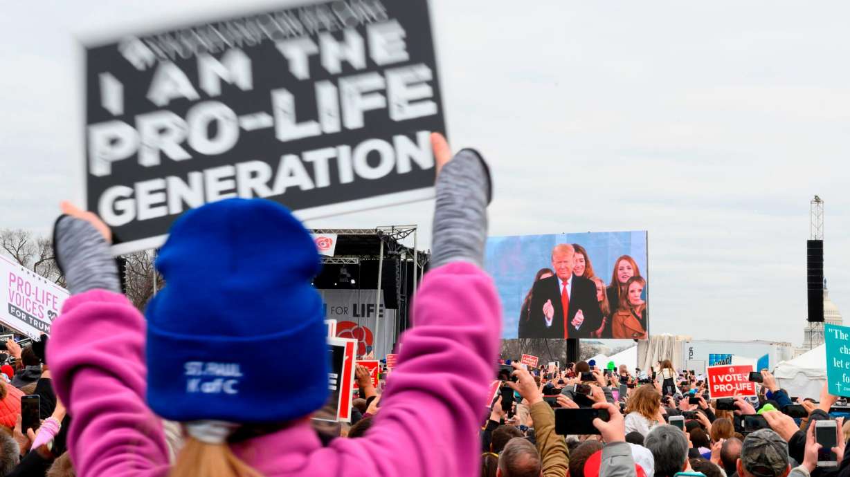 Pro-life demonstrators listen to US President Donald Trump as he speaks at the 47th annual "March for Life" in Washington, DC, on January 24, 2020. - Trump is the first US president to address in person the country's biggest annual gathering of anti-abortion campaigners.