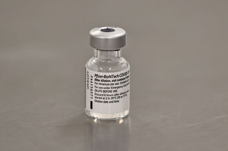 FILE PHOTO: A vial of the Pfizer/BioNTech COVID-19 vaccine is seen ahead of being administered at the Royal Victoria Hospital, on the first day of the largest immunisation programme in the British history, in Belfast, Northern Ireland December 8, 2020. Liam McBurney/Pool via REUTERS//File Photo