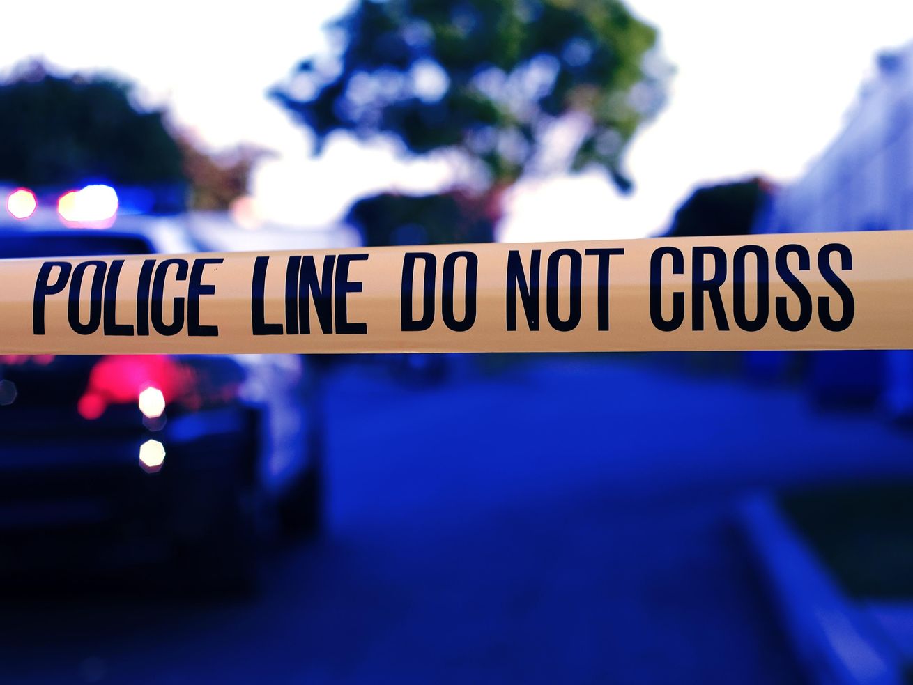 Police arrested a man Thursday who allegedly was able to grab an officer's gun and fire a round through the holster before a witness stepped in to help the officer. 