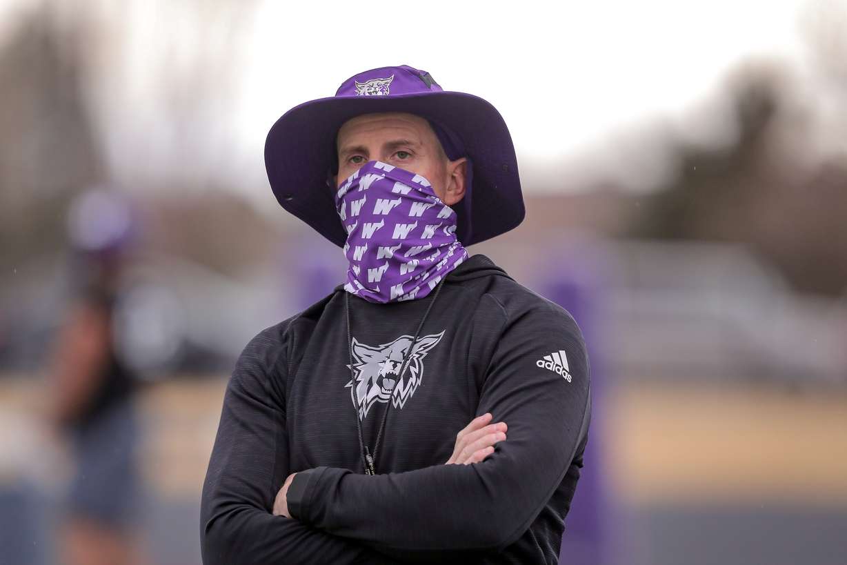 Weber State coach Jay Hill watches during the Wildcats' first practice of the 2021 spring season, Friday, Jan. 21, 2021, in Ogden.