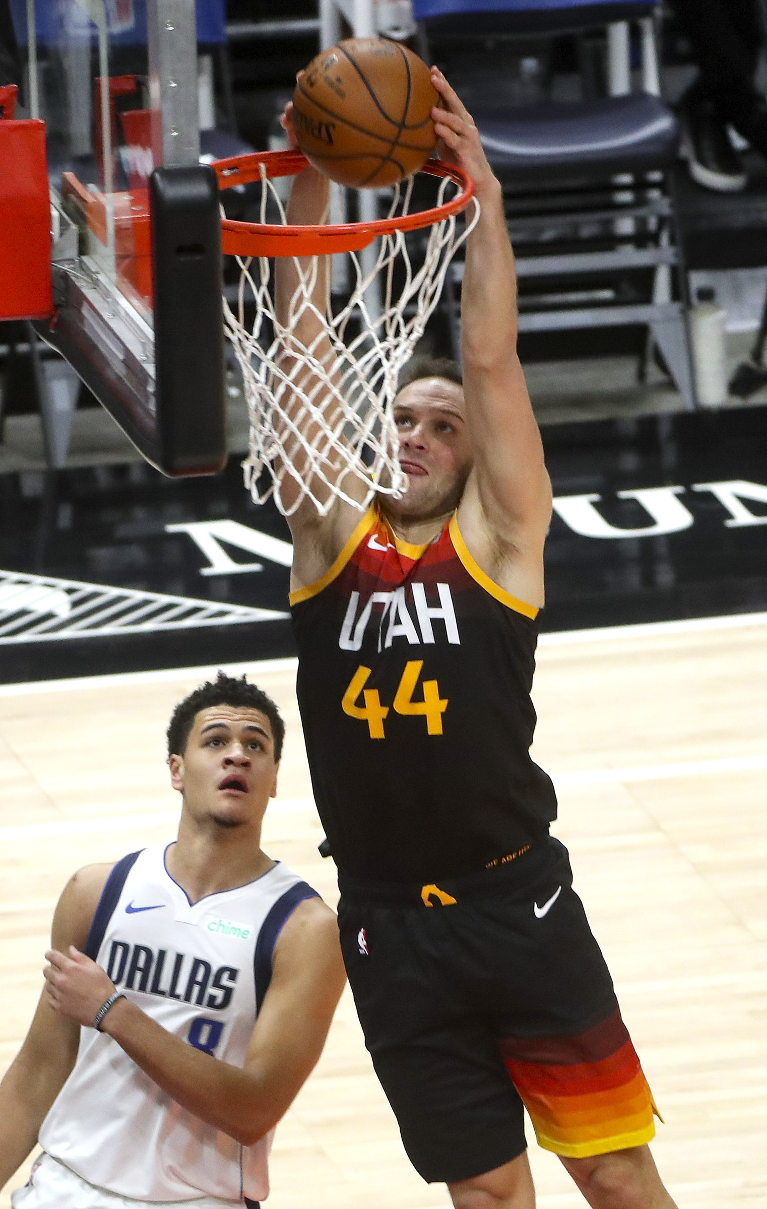 Utah Jazz forward Bojan Bogdanovic (44) dunks the ball over Dallas Mavericks guard Josh Green (8) during an NBA game at Vivint Smart Home Arena in Salt Lake City on Friday, Jan. 29, 2021.