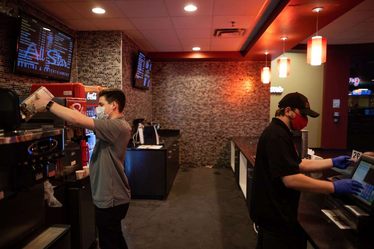 Matt Prejean, left, and Shawn Johnson work in the cafe at All Star Bowling & Entertainment in Draper on Tuesday, Jan. 26, 2021.